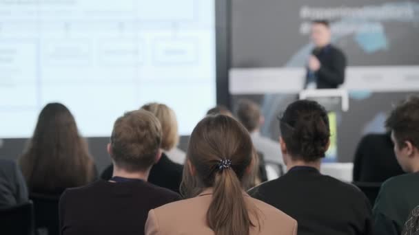 Audience watching presentation during business seminar — 图库视频影像