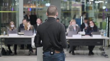 Male speaker talking to audience