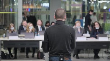 Male speaker talking to audience