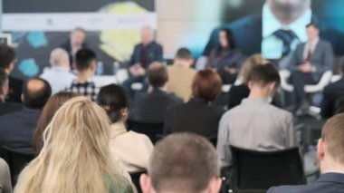 Audience listening to online speaking during seminar