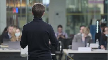 Male speaker talking to audience