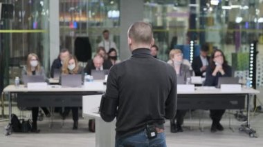Male speaker talking to audience