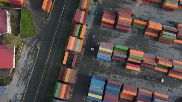 Trucks driving near cargo containers — стоковое видео