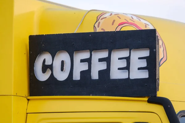 Coffee sign on yellow van — Stock Photo, Image