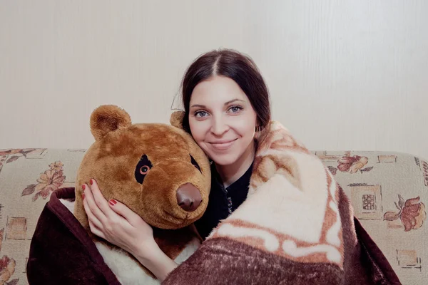 Woman with teddy bear — Stock Photo, Image