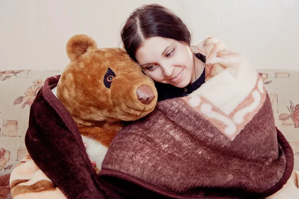 Woman with teddy bear — Stock Photo, Image