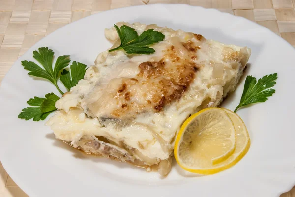 Fish baked under cheese — Stock Image Fish baked under cheese Royalty Free Stock Photos