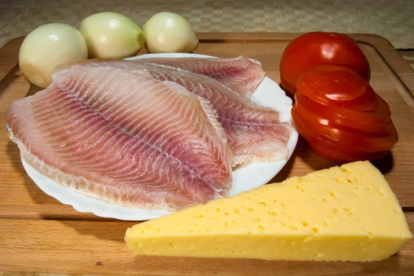 Cheese, tilapia and tomatoes — Stock Image Cheese, tilapia and tomatoes Stock Image
