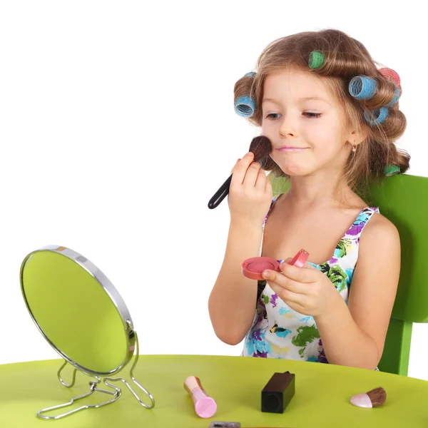 Lilla flickan att göra makeup Stockbild