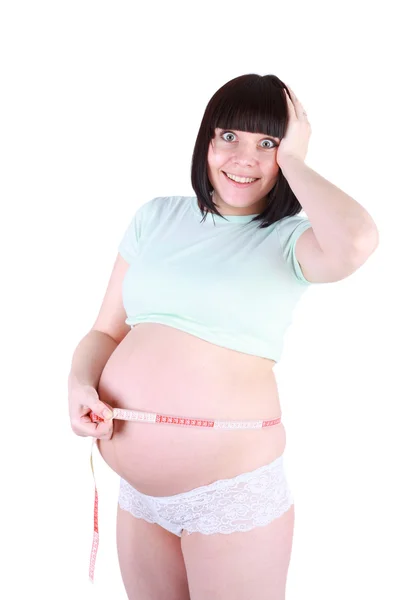 Mulher grávida medindo sua barriga — Fotografia de Stock