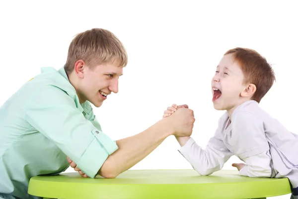 Brothers arm wrestling — Stock Photo, Image