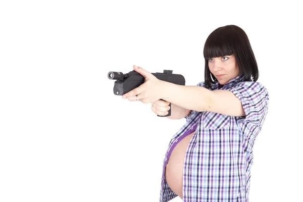 Gravid kvinna med pistol — Stockfoto