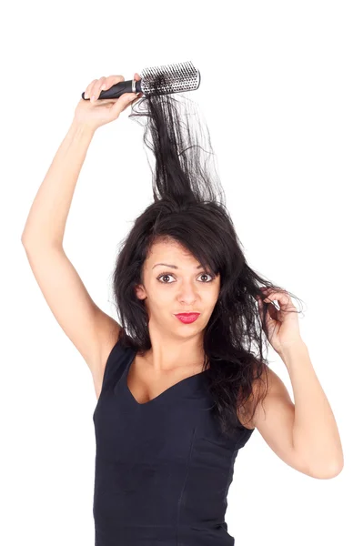 Mujer peinándose el pelo — Foto de Stock