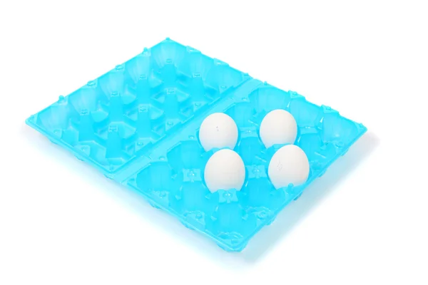 Chicken eggs in blue plastic container — Stock Photo, Image