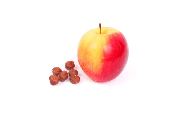 Apple and hazelnuts — Stock Photo, Image