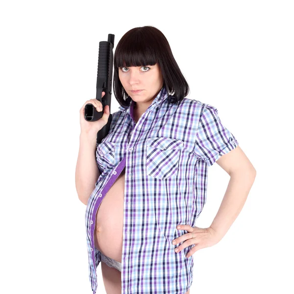 Zwangere vrouw met het pistool — Stockfoto