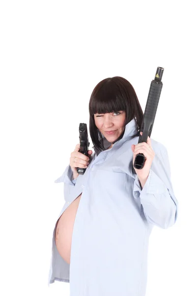 Kobieta w ciąży z pistoletem w dłoni — Zdjęcie stockowe