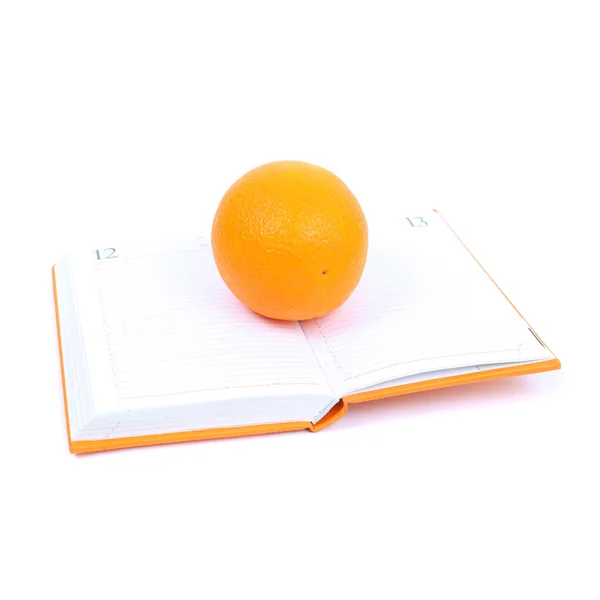 Orange på dagboken — Stockfoto