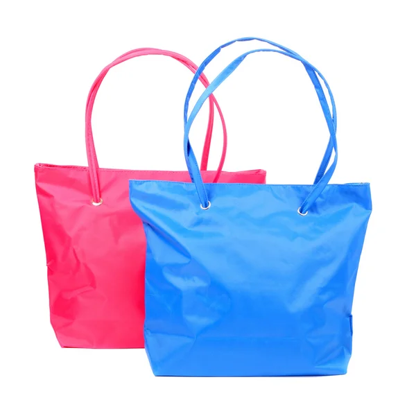 Синие и розовые сумки — стоковое фото