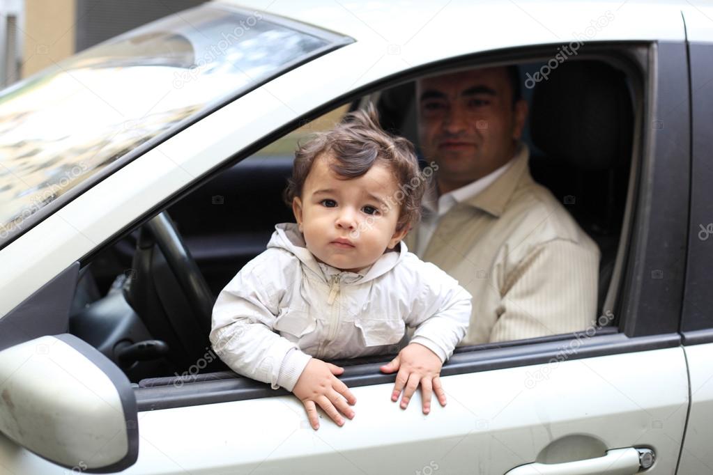 Baby with his father in the car