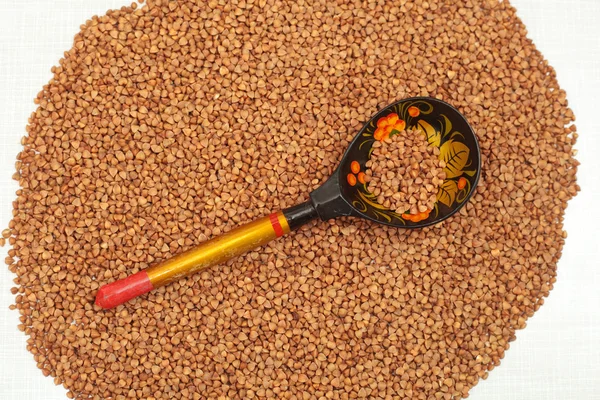 Buckwheat and spoon — Stock Photo, Image