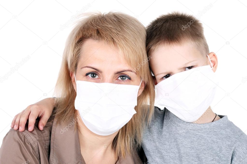 Mother and child in the protective masks