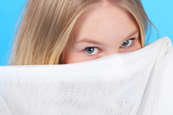 Irl hiding behind the white textile — Stock Photo, Image