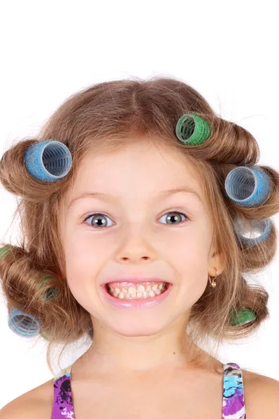 Little girl wearing the curler — Stock Photo, Image