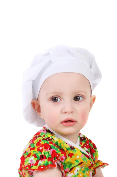 Petit bébé dans la casquette de cuisson — Photo