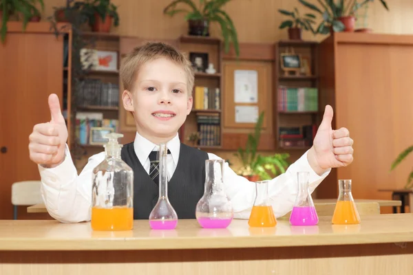 Boy with the pink chemical agent tubes — Stock Photo, Image