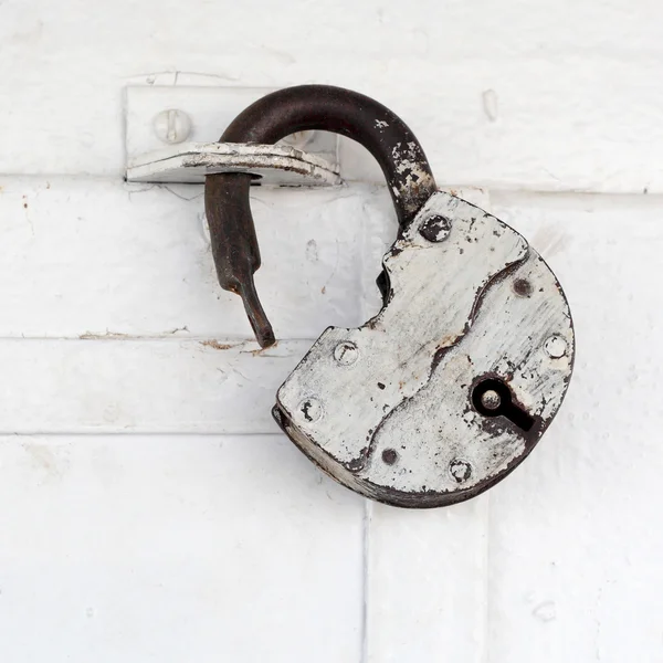 Padlock on the white door — Stock Photo, Image