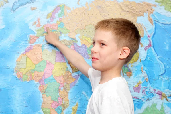 Little boy near the wall map — Stock Photo, Image