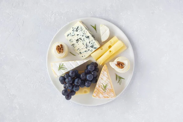 Cheese Plate Served Grapes Walnuts Grey Concrete Background Top View Stock Picture