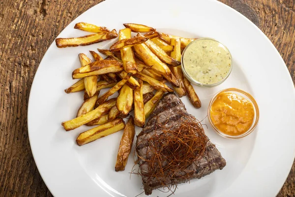 steak with chili and french fries