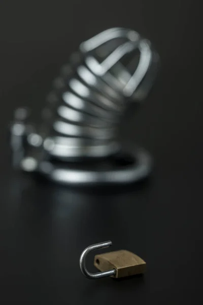 lock with a cock cage on black