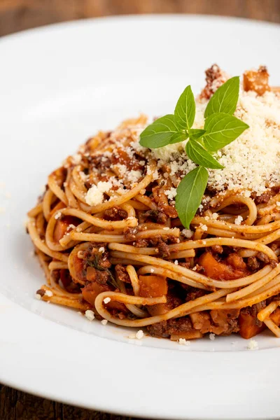 spaghetti with sauce bolognaise on white