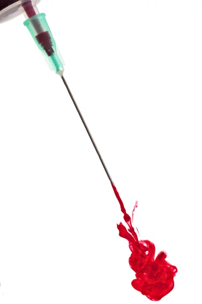 Stream of red liquid from needle — Stock Photo, Image