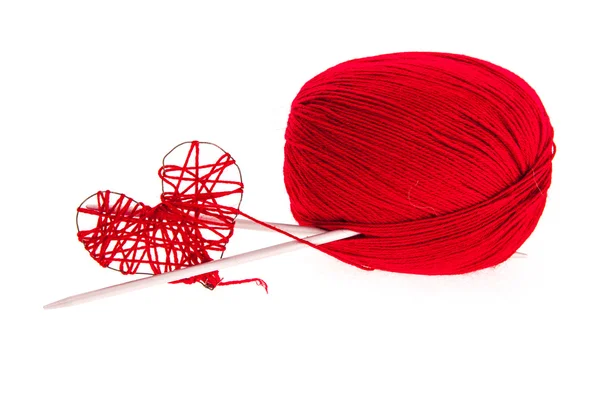 Knitting yarn with needles and a heart — Stock Photo, Image