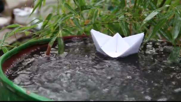 Rain water falling from uphigh into large metal water can — Stock Video