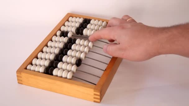 Male hand using the abacus to calculate basic algebra adding and subtracting — Stock Video