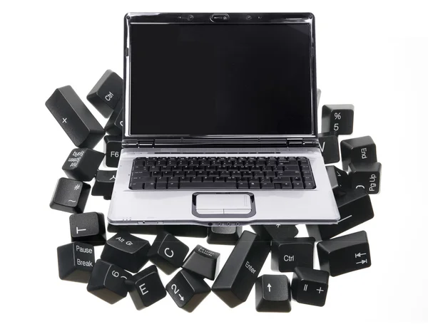 Laptop e teclas de computador — Fotografia de Stock