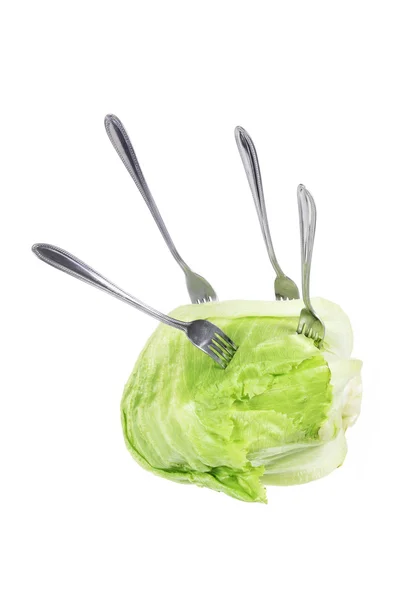 Forks on Iceberg Lettuce Stock Photo