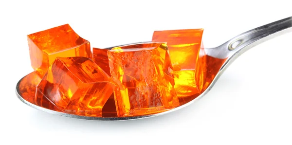 Jelly cubes on silver spoon — Stock Photo, Image