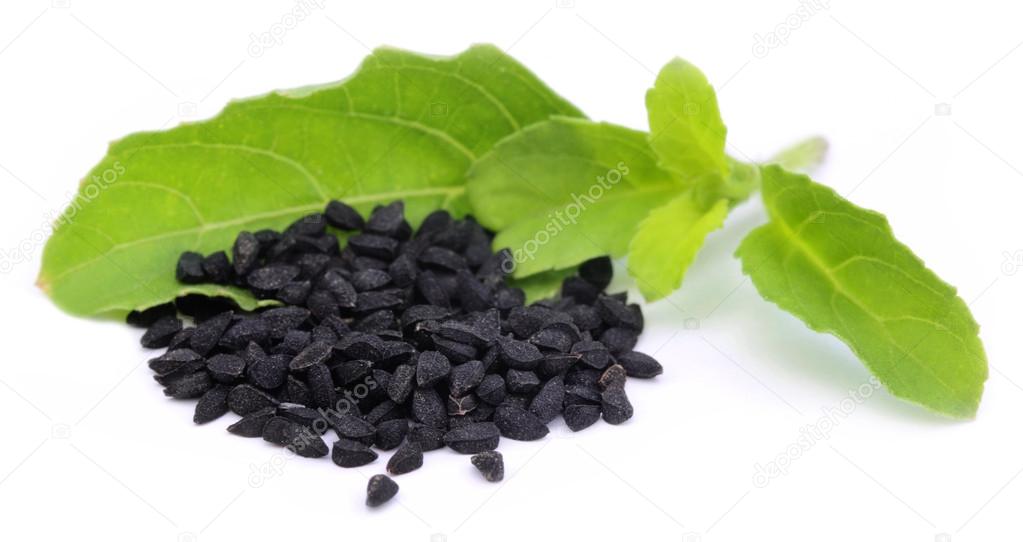 Nigella or black cumin with a medicinal tulsi leaves