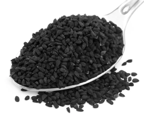 Nigella o cumino nero su un cucchiaio d'argento — Foto Stock