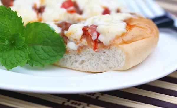 Pizza with mint leaves Stock Photo