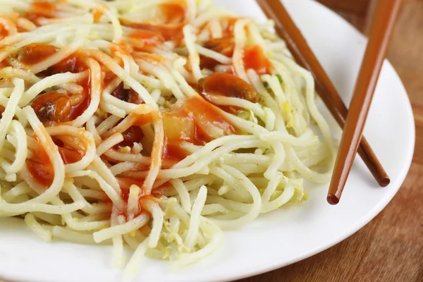 Cooked noodles with chopsticks — Stock Photo, Image