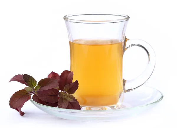 Cup of herbal tea with red tulsi leaves — Stock Photo, Image