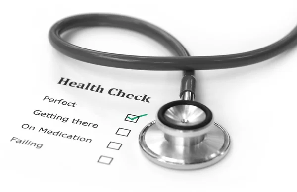 Health checklist and a stethoscope — Stock Photo, Image
