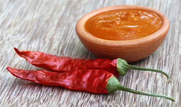 Red hot chilies with ground paste — Stock Photo, Image